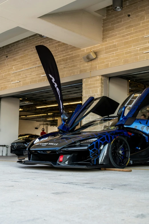 an exotic blue car in the show room