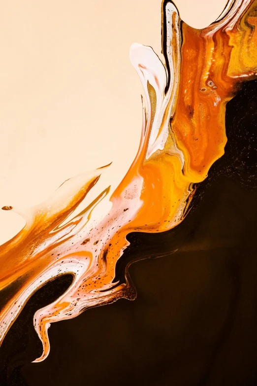 a close up image of water and gold swirl