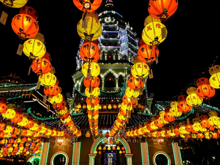 a night time s of many hanging lanterns