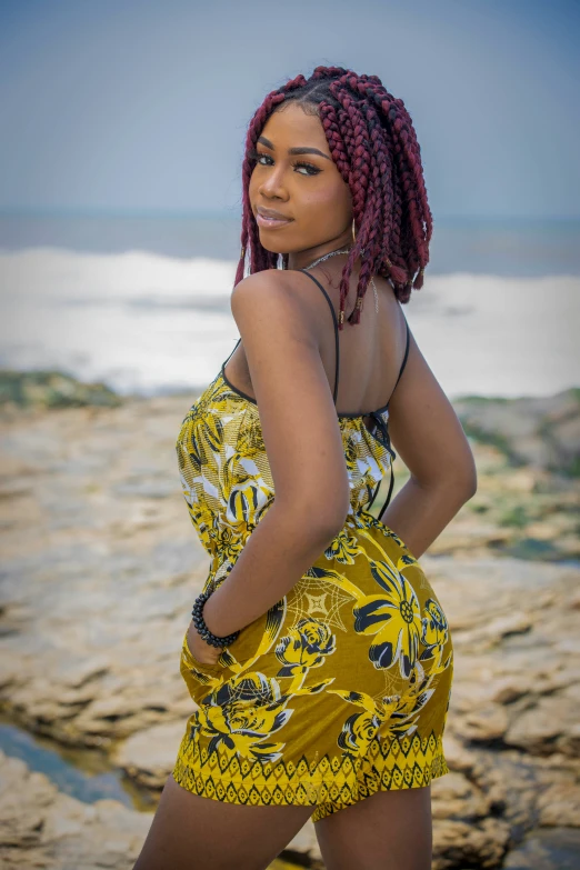 a woman with red hair wearing a yellow dress