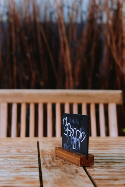 a table that has a small chalk board on it