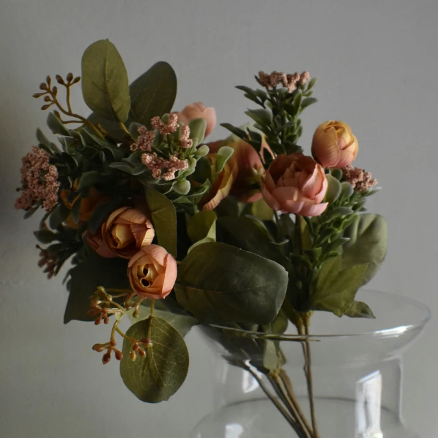 some flowers sitting in a clear glass vase