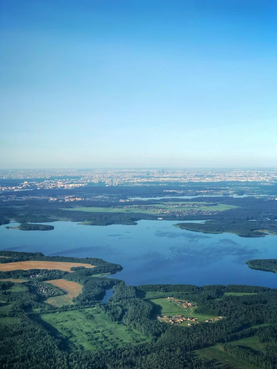 a view over water with a plane on the far side