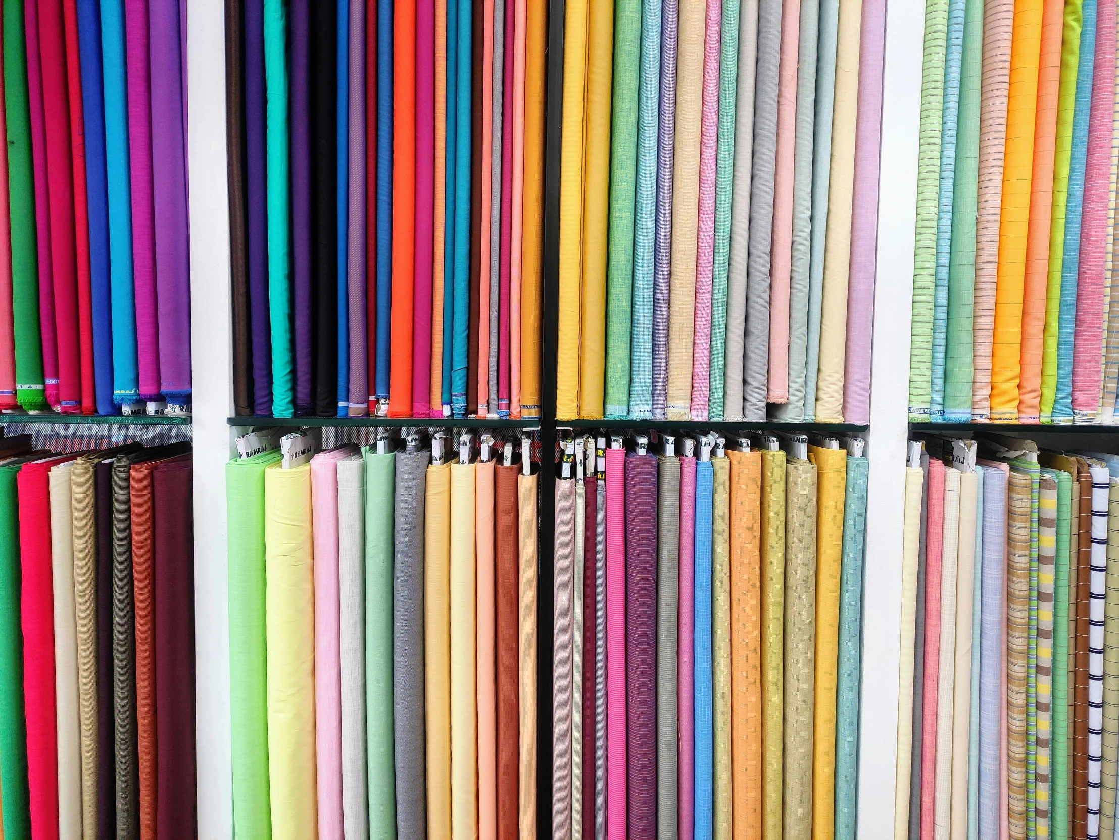 a rack filled with different colored paper