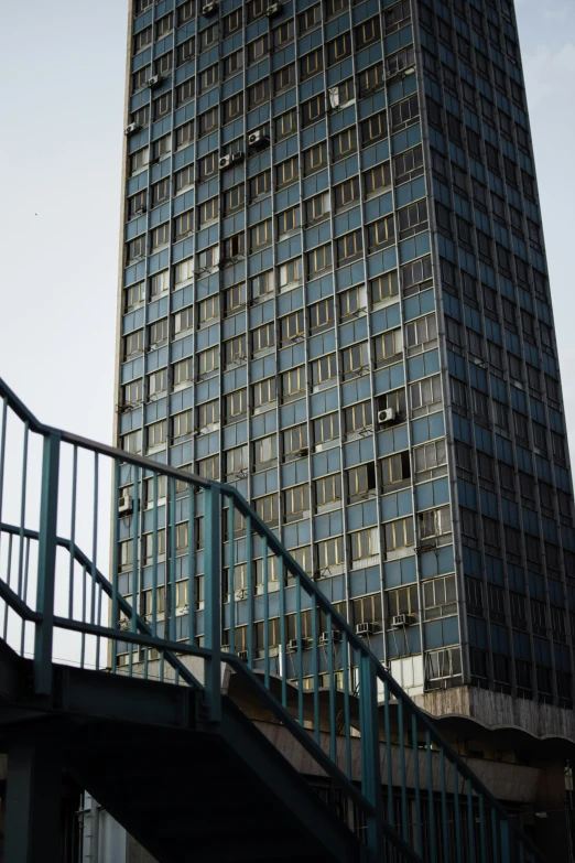 some blue and black glass stairs and a building