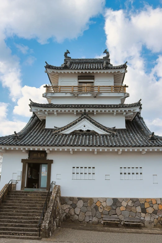 there is a very large white building with stone steps