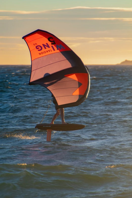 a person riding a wind sail over a body of water