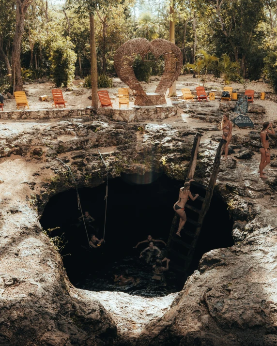 people playing around in a hole that's not too dark