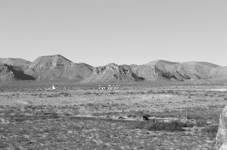 a black and white po with mountains in the background