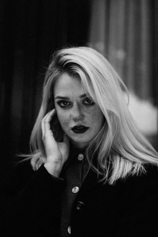 black and white pograph of a woman talking on the phone