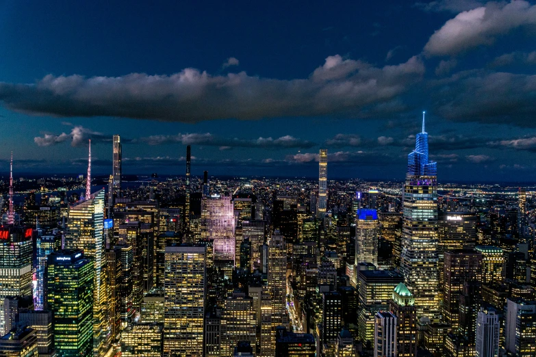 a city is shown with lights and buildings lit up at night