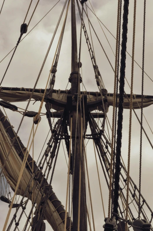 a cross on the mast of an old sailing vessel