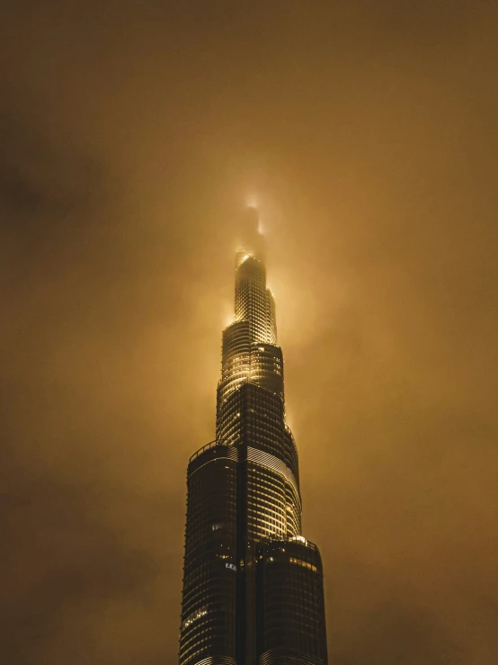 the top of a tall building on a foggy day