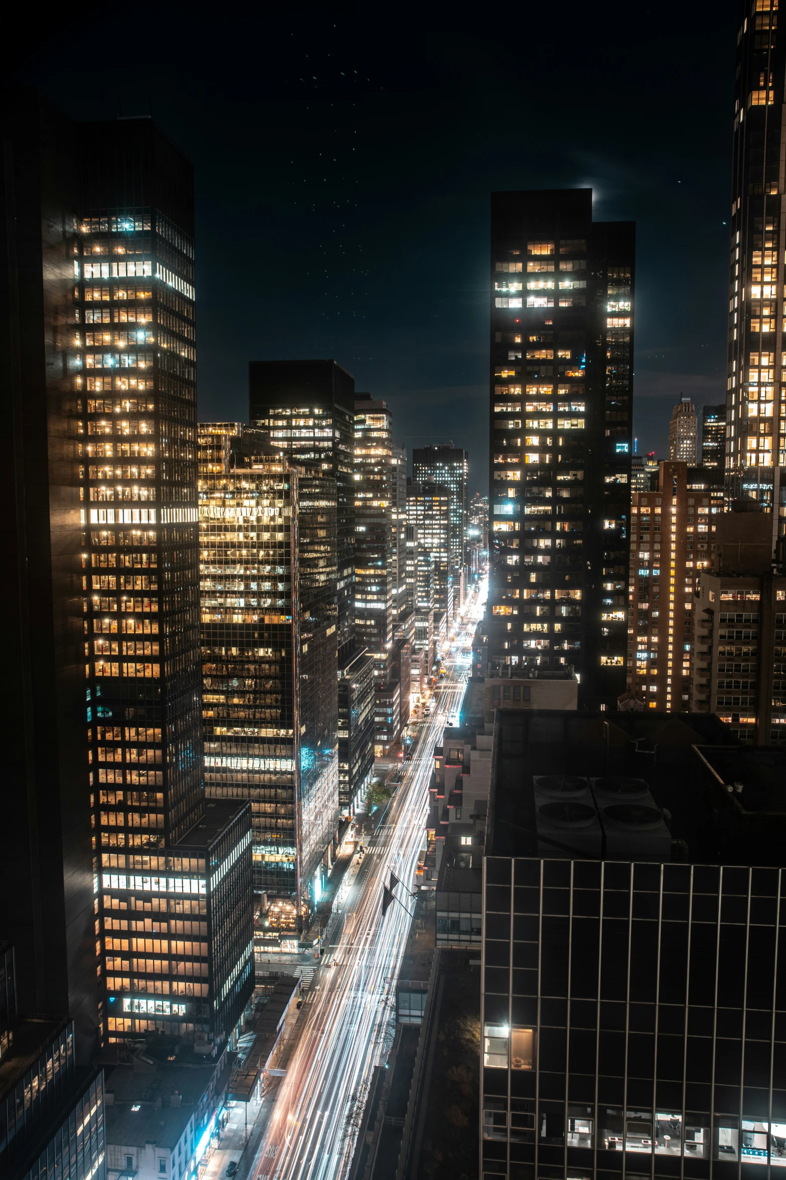 a city skyline with street lights and tall buildings