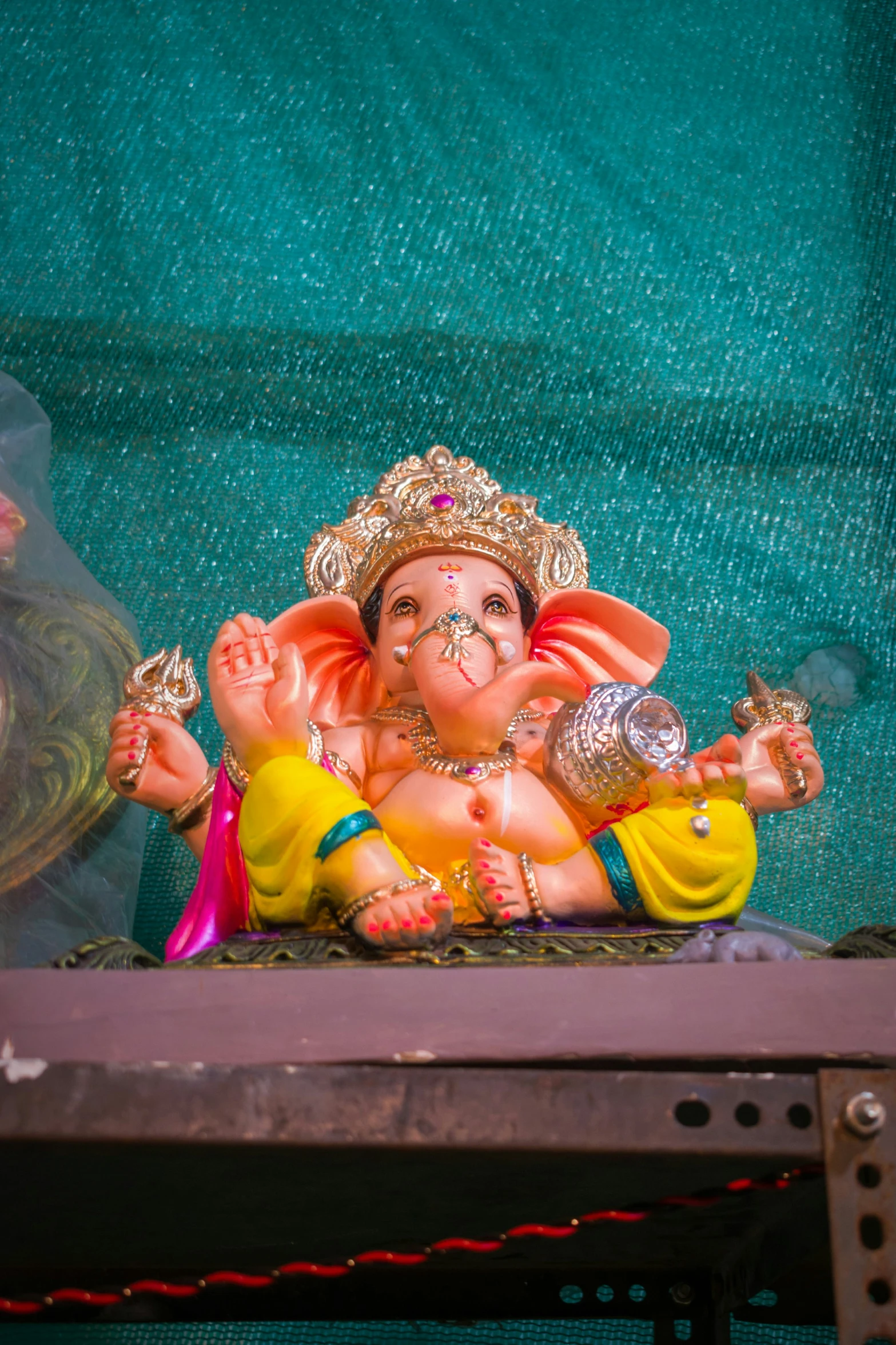 a statue of an ganesh on the shelf