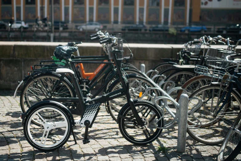 many bicycles are parked next to each other