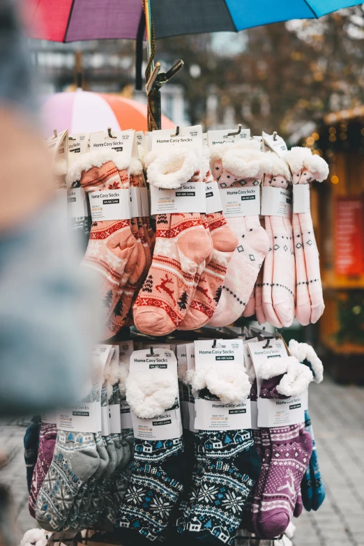 this display has several pairs of slippers and socks on it