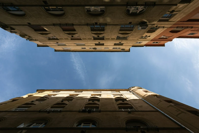 looking up at tall buildings from below