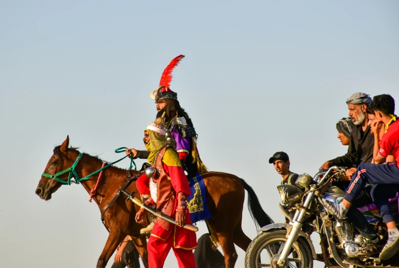 two men on horses with riders in the back