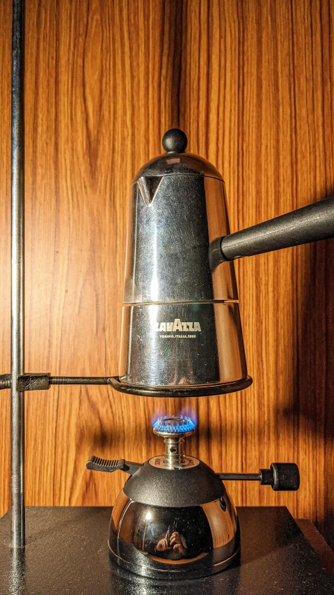 an image of a coffee pot on a burner