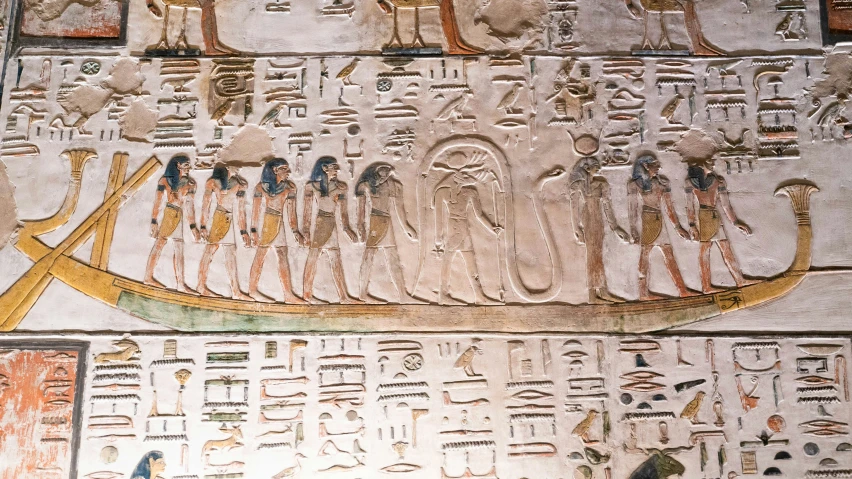 a detailed wall with egyptian art and writing