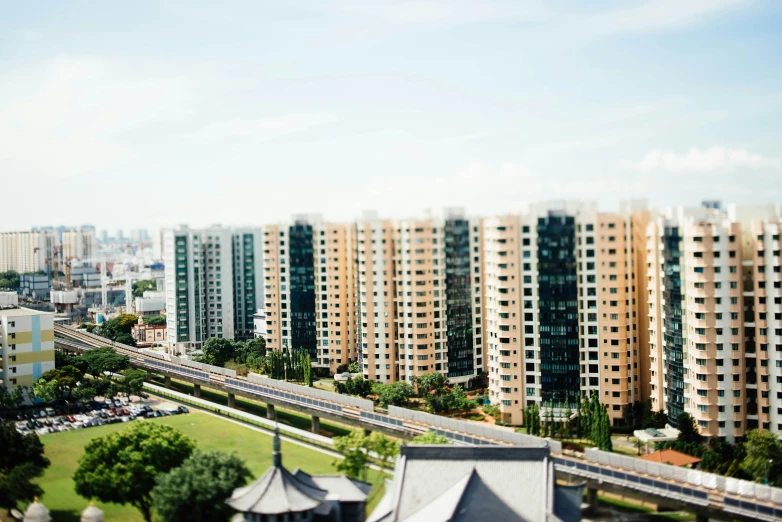 a train passing through a large city with tall buildings