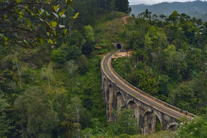 a railroad that is going over a bridge