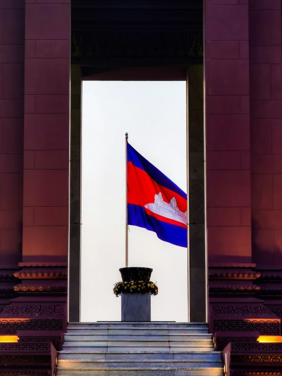 two flags that are near some steps