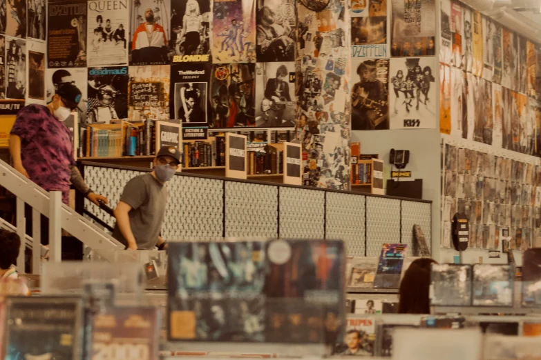 a man sitting on top of a staircase in a music store