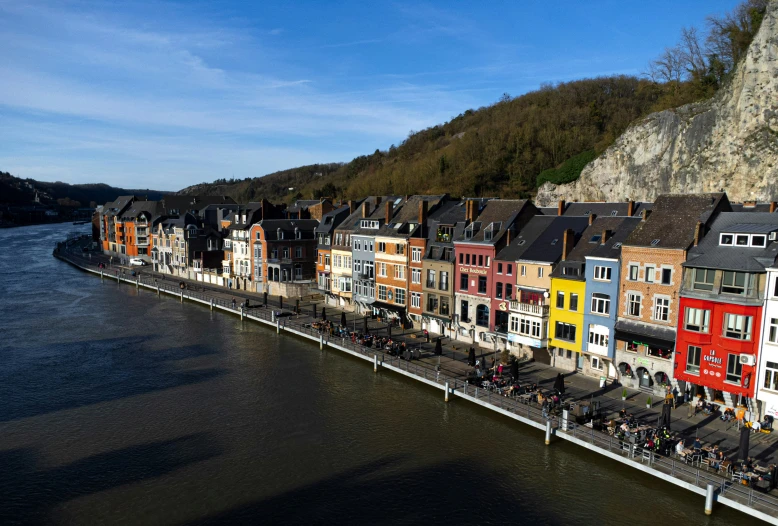 several buildings line the water along a bridge