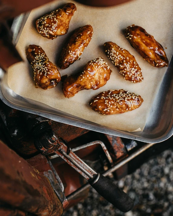 a pan with seven pieces of baked pastry