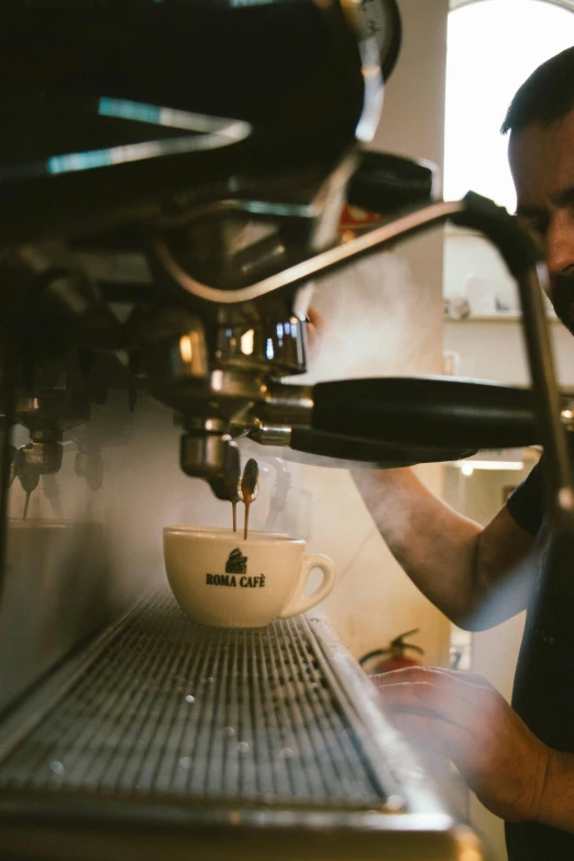 a man making a cup of coffee