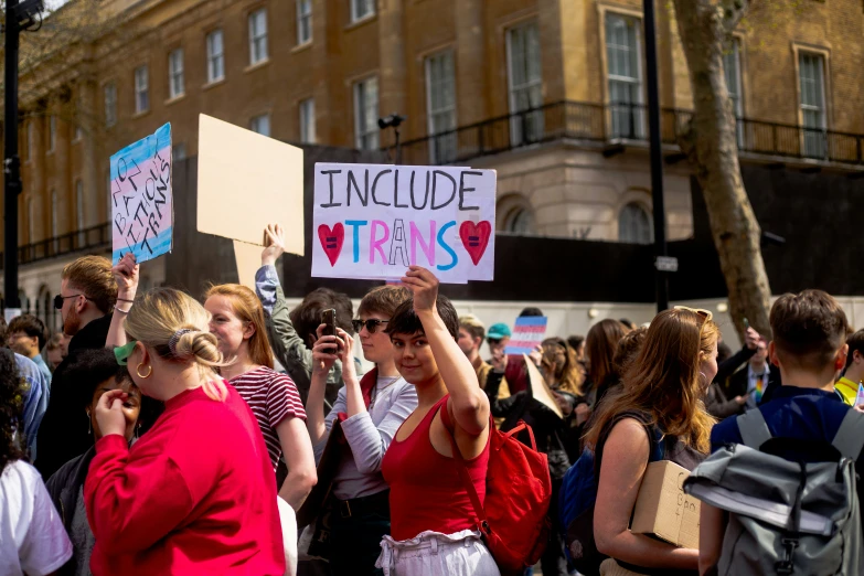 some people are protesting outside on a street