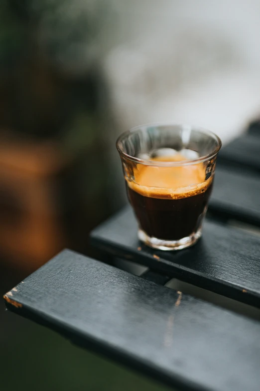 an empty glass on top of a wooden table