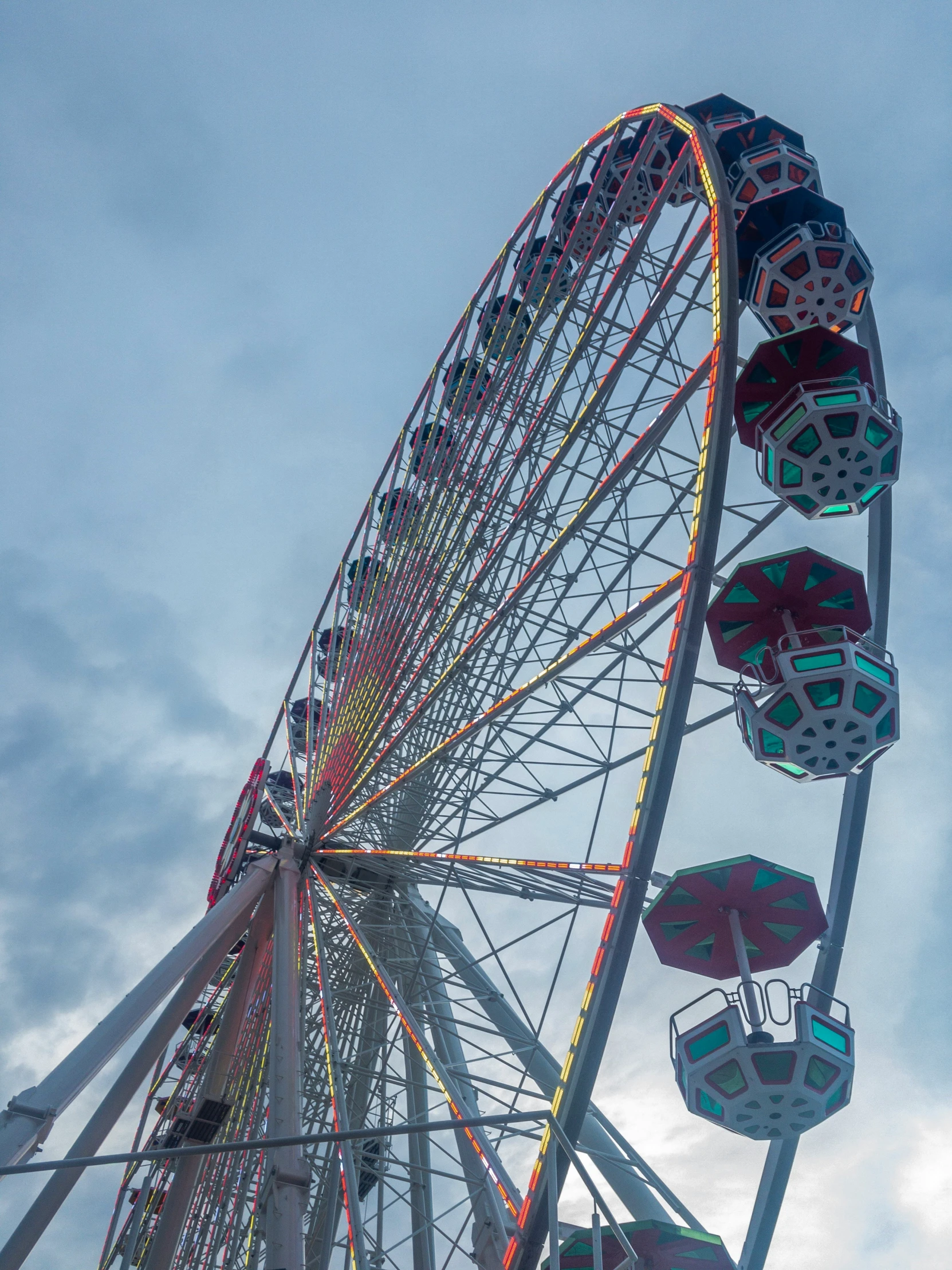 a big ferris wheel with colorful designs on it