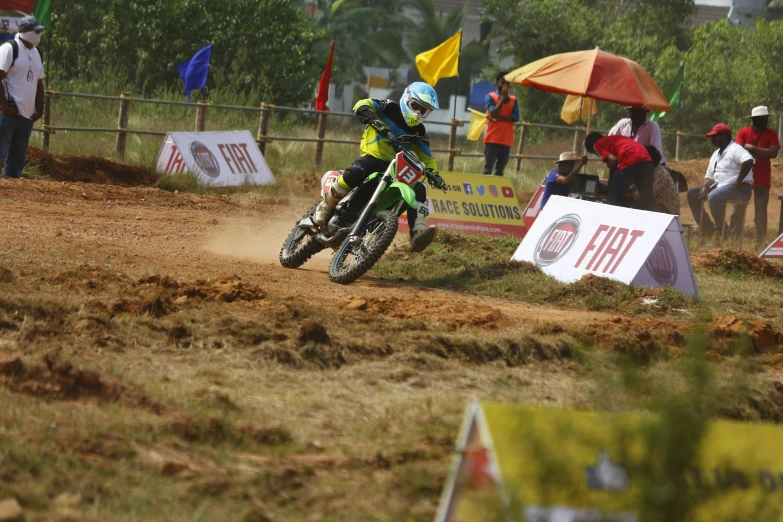 people watching a motorcycle race on dirt bikes