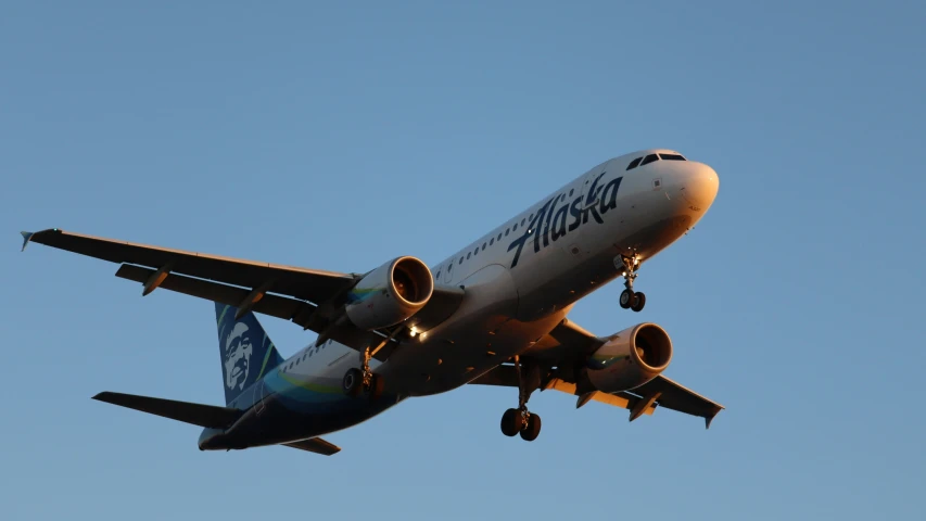 a passenger plane is flying through the sky