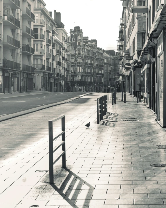 black and white po of city street with buildings