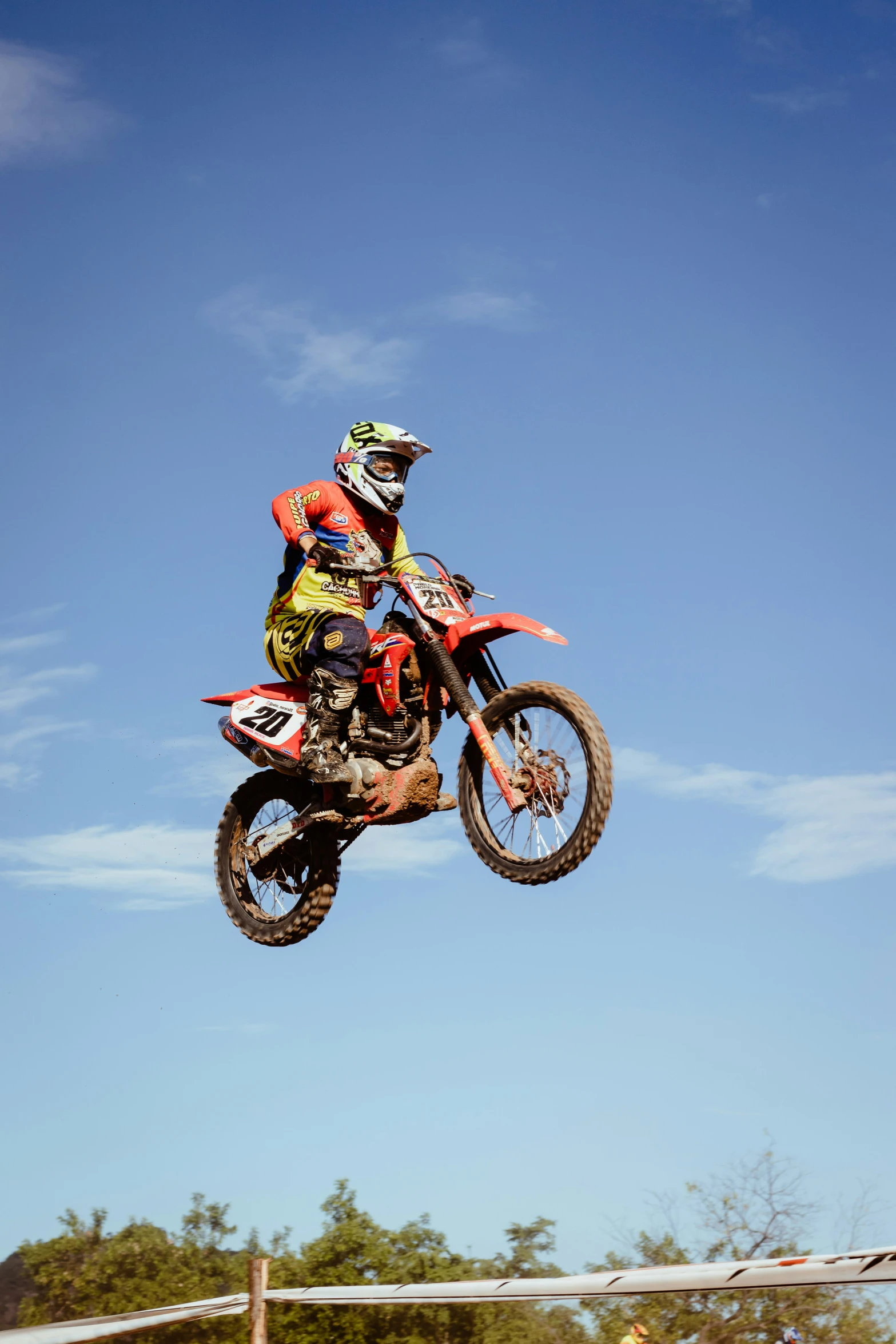 man jumping off a motorbike in mid air