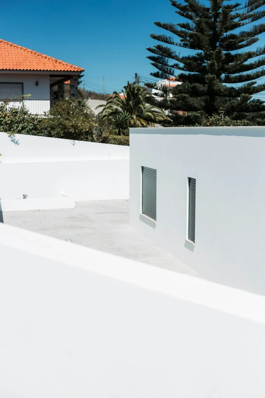 a skateboarder on the top of an empty ramp