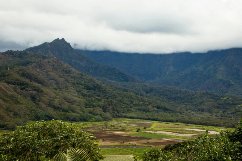 a mountain range with a small valley in the distance