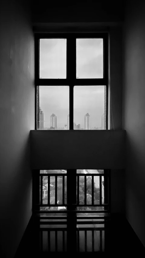 an empty room with a large window and view