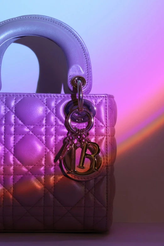 the chanel bag is purple and metallic