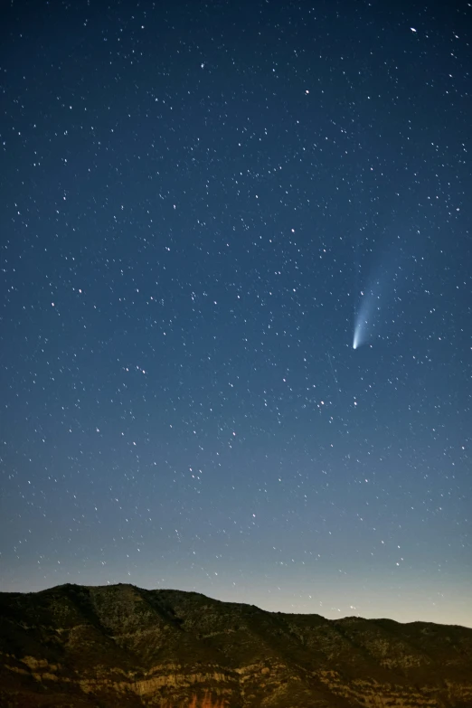 a bright object flying across the sky in the distance