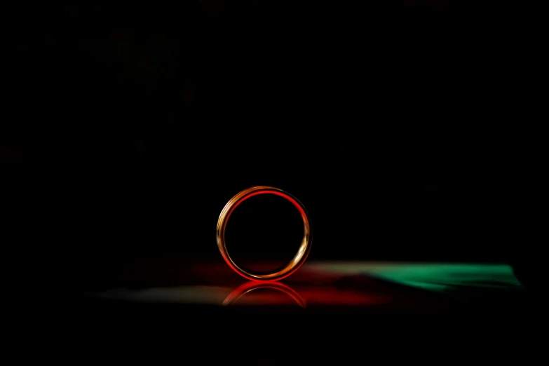 the shadow of a ring in a dark room