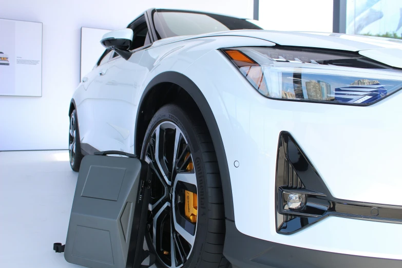 a car is parked on display, with its hood up