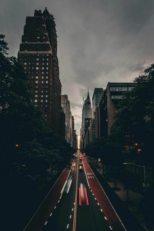 traffic on the street between two large building