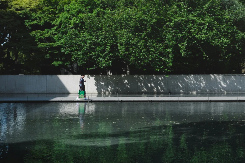 a man standing in the middle of a large lake