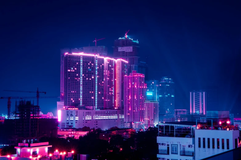 a large group of buildings lit up at night