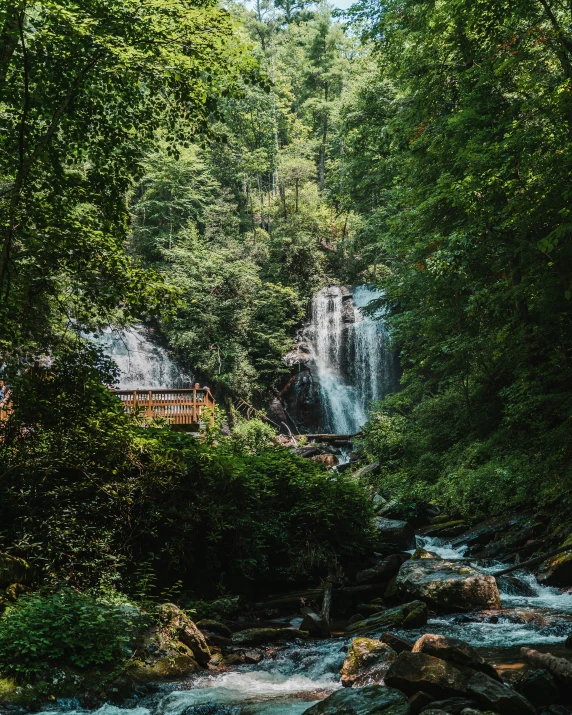 waterfall and a cabin in the forest